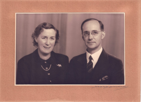 A studio portrait of Mr and Mrs WH Greaves, in black and white and printed on photographic paper mounted on a brown coloured card, dated early 1950's
