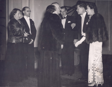 Black and white photograph showing WH Greaves and wife looking on as the Mayor and Mayoress greet two visitors.  A seventh person is also standing in the background.