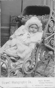 Photograph, C. Hewitt Stawell Photographic Co, Thelma Philips nee Raitt as a baby in a cane pram c 1900