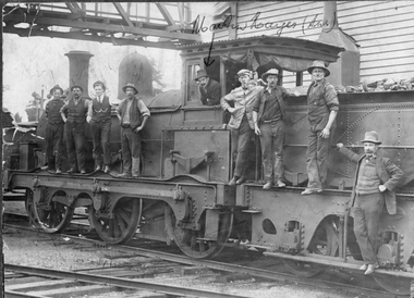 Photograph, Steam Rail Engine & Workers standing on steam engine. c1900