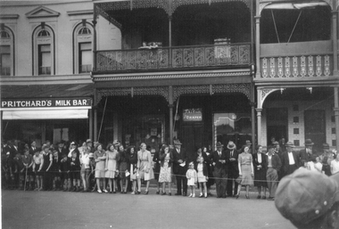 Photograph, Crowd lining up in the Main Street near Town Hall Hotel c1940's