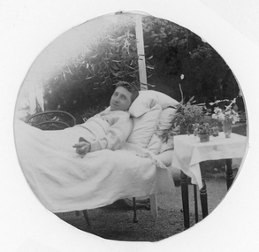 Photograph, Mr Colin Campbell Heron reclining in bed