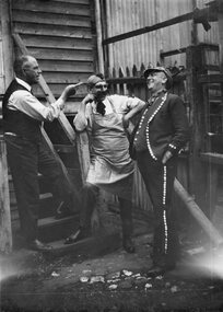 Photograph, Three men in Fancy dress  -- behind W Carters Boot Shop in Main Street 1922