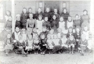 Photograph, Private School Teachers & Students on verandah of a weatherboard building