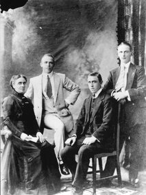 Photograph, One female and three males -- Studio Portrait
