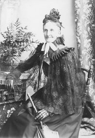 Photograph, Unknown older lady seated with umbrella -- Studio Portrait at the Stawell Photographic Co