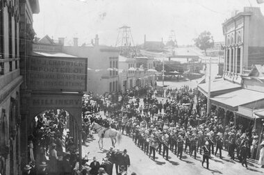 Photograph, Upper Main Street Stawell procession with the band & a Constable on Horseback visible c1901