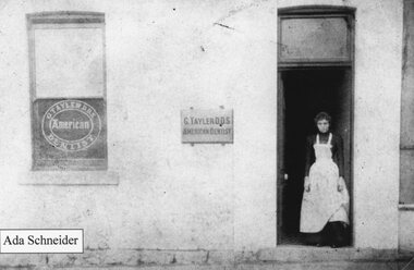 Photograph, Ada Schneider standing in doorway of G. Tayler (DDS) American Dentistry c1895