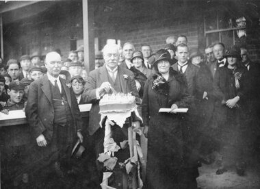 Photograph, Stawell Technical School Group celebrating by cutting a cake