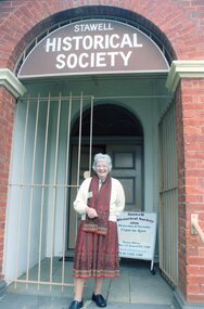 Photograph, Dorothy Brumby – President Stawell Historical Society on the steps of old Pleasant Creek Court House 2015