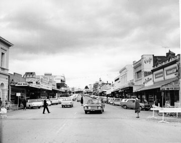 Photograph, Main Street Stawell looking East across Wimmera Street near Post Office with Vehicles angle parked c1970