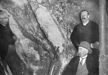 Photograph, "Amalgamated Scotchmans" Underground Mine with the face at the 1100 ft level & 3 men inspecting the Quartz Reef