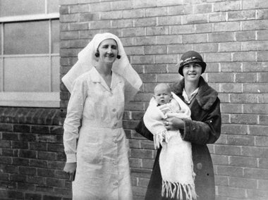 Photograph, Stawell Hospital's First Maternity Nurse, Sister V M Spears, with Mrs W.J. O'Neill nee Unknown & the first baby born in the new hospital