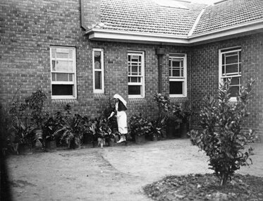 Photograph, Stawell Hospital's Matron Lang In her garden