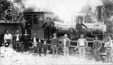 Photograph, Two Boag Men and others in front of a Steam Locomotive