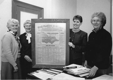 Photograph, A.N.A. Tree Planting Scheme used in the 1930's  -- presentation to the Historical Society: Jean Chatfield (ANA), Marie Van Leeuwen (SHS), Angela Murphy- Town Clerk, Dawn Miller (SHS)