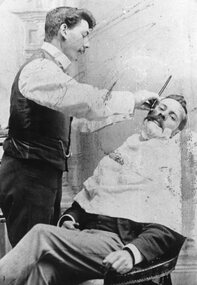 Photograph, Mr George Giles shaving his brother Mr Charlie Giles in their Hairdressing Business in Main Street Stawell