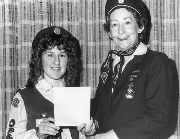 Photograph, Stawell Guide Megan Croft receiving her B P Certificate Award 1988 by State Commissioner Maren Chandler