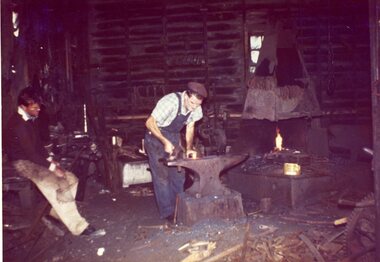 Photograph, Mr Frank Heal, blacksmith at work at Mr Alf Heals premises -- the last of the Shoeing Forges to operate in Stawell -- Coloured
