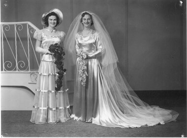Photograph, Mrs Joan McIntyre nee Mitchell at her wedding with her sister Mrs Patricia West nee Mitchell
