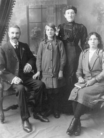 Photograph, Dick Family -- Two adults and two young girls -- Studio Portrait
