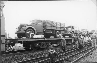 Photograph, Anniversary Train Visit to the Stawell Railway Station with a Flat top vehicle carrier carrying Army Trucks 1995