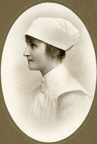 Photograph, A female in Nurses Uniform c1910 with love and best wishes from Ivy George on the back