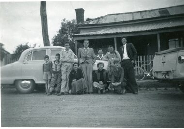 Photograph, Anyon Family with car in front of residence Houston Street