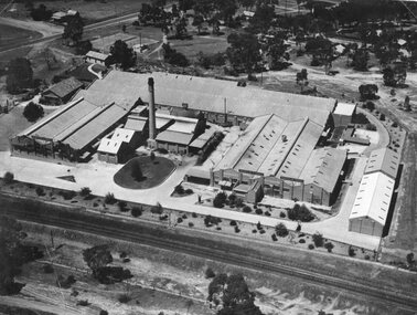 Photograph, North Western Woollen Mills with the Rail line in foreground -- Aerial View