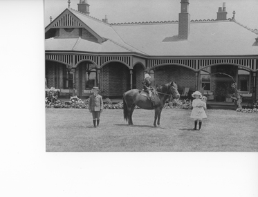 Photograph, “Swinton” Homestead in Glenorchy with Mr and Mrs Gray's 3 children on the lawn