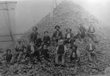Photograph, Federal Mine Workmen & Boys sitting an a Mullock heap