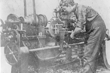 Photograph, Young and Ledgars Engineering Works with a workman using Belt Driven Lathe