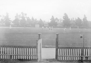 Photograph, Stawell Central Park Sports Oval with Cricketers & Gate in foreground