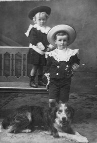 Photograph, 2 Unknown children and a dog -- Studio Portrait