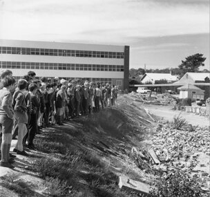Photograph, Stawell Technical School with Students vewing the remains of old Chimney 1970
