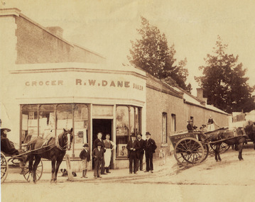 Photograph, Mr R. W. Dane, Grocer & Baker on the corner Main Street & Layzell Street from P.C. News Supplement 1888 -- Sketch