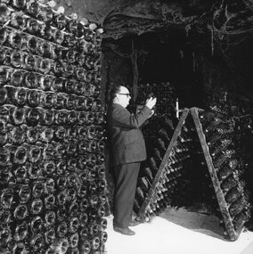 Photograph, Seppelts Cellars in Great Western with a worker inspecting a bottle