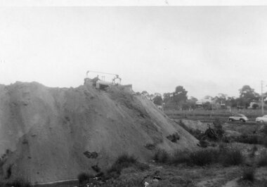 Photograph, Mr French on a Grader on top of a Soil Heap -- Possibly in Great Western