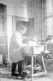 Photograph, Stawell Technical School Workshops with a student at work with foot operated potters lathe 1923-1924