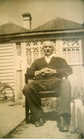 Photograph, Mr Joseph Mitchell taken in later years with his home in the background