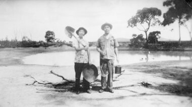 Photograph, Miss Ann Mow Fung & her father Mr Fred Mow Fung with shovel gold panning dish and billy -- Mr Fred Mow Fung's father had a hotel at Deep Lead