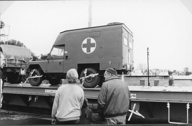 Photograph, Anniversary Train Visit to the Stawell Railway Station with a Flat top vehicle carrier carrying an Army Ambulance 1995
