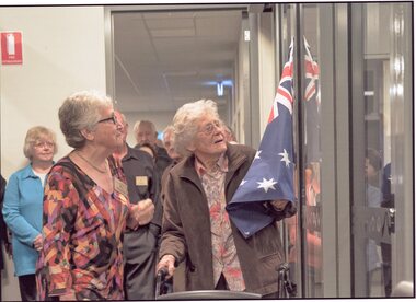 Photograph, Dorothy King unveils the wording on the glass panel of "Stewart Bradley Research Centre" 2016