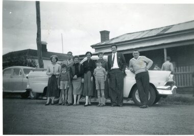Photograph, Anyon Family with car in front of residence Houston Street