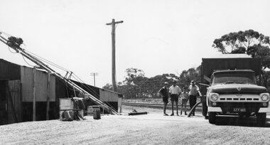 Photograph, Grain Storage Site beside railway line in Griffin Street with a truck unloading