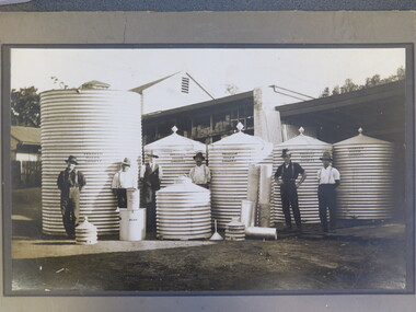 Photograph, Mr T Barker -- Tank Maker & Timber Mercahant with workers in front of the water tanks