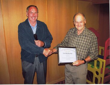 Photograph, Mr Ian Cox receiving Life Membership Certificate from Show President Mr Geoff Erwin -- Coloured