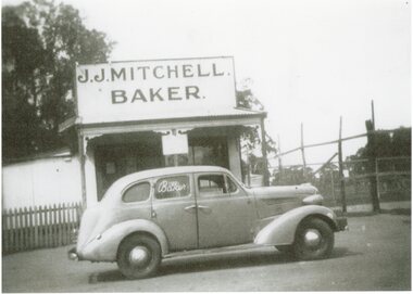 Photograph, J J Mitchell Baker's Shop in Glenorchy with a Sedan parked outside
