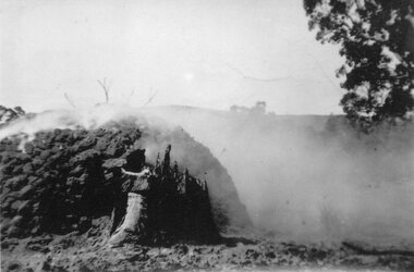 Photograph, Charcoal Burning in Fyans Creek area with part of the kiln formation