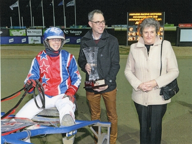 Photograph, Kerryn Manning in the harness with male holding trophy & another person &  Kerryn Manning with Cup & Flowers. 2017 -- 2 Photos -- Coloured
